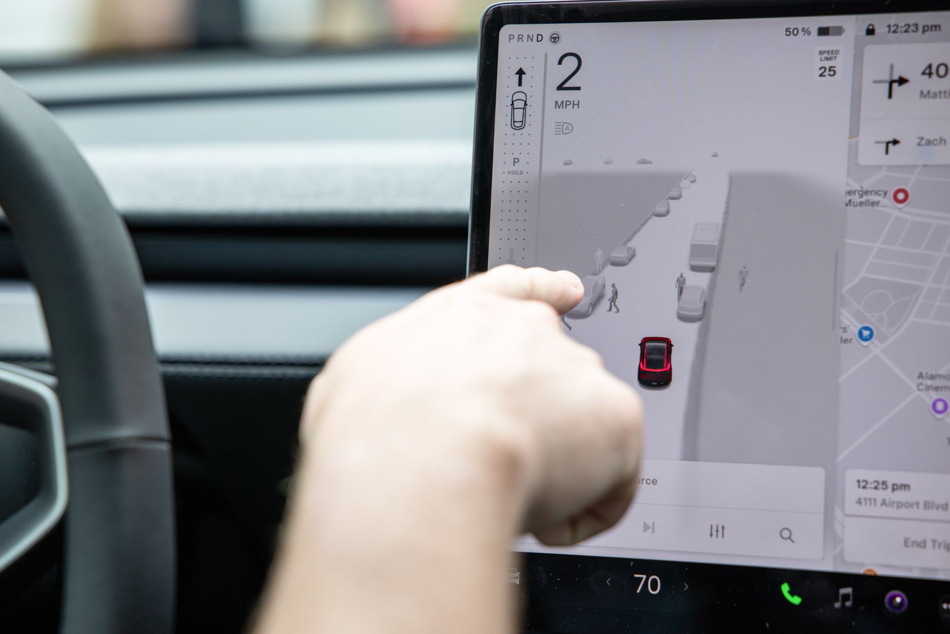 A Tesla Model Y screen showing its Full Self-Driving software