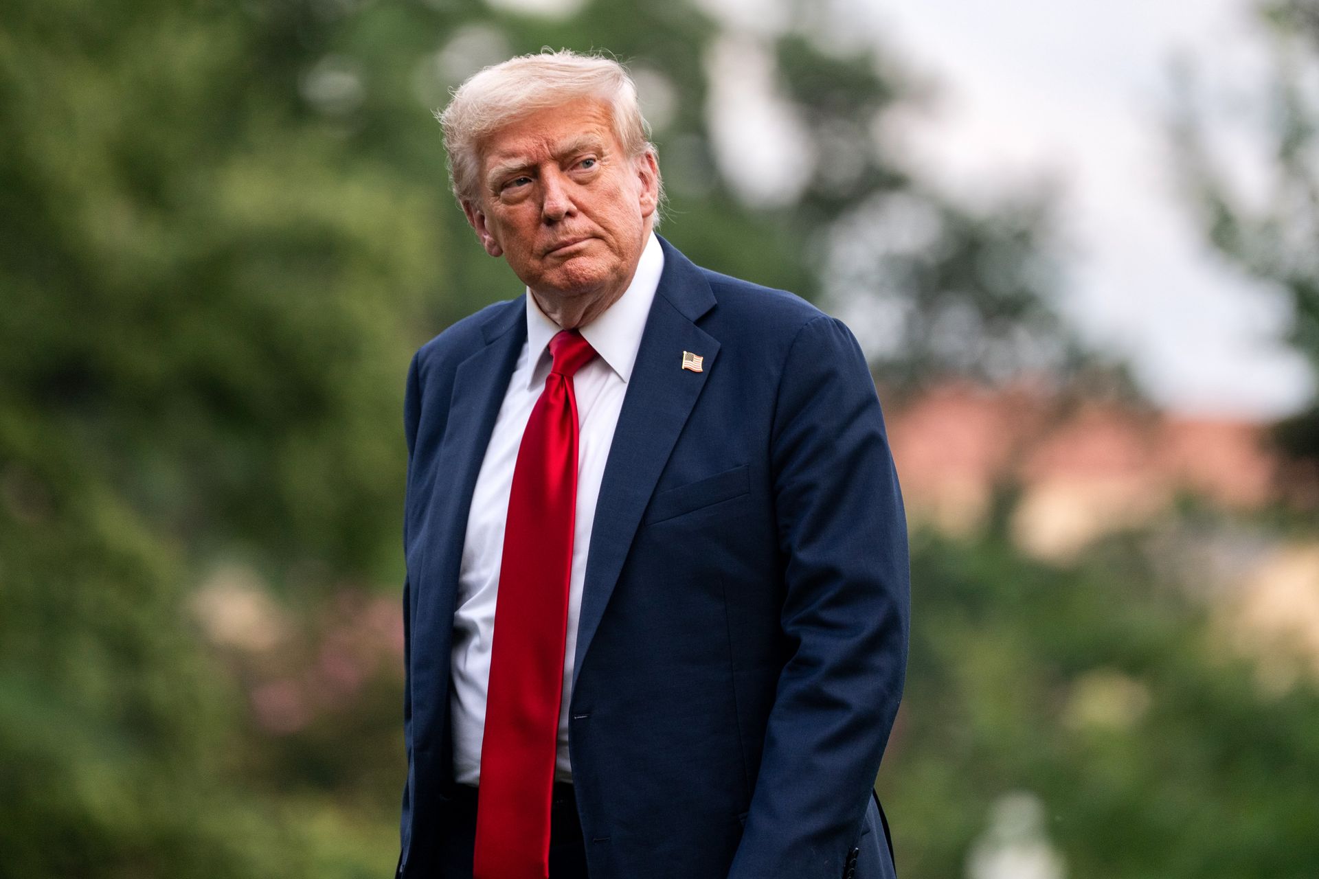 President Donald Trump (dark suit, red tie)