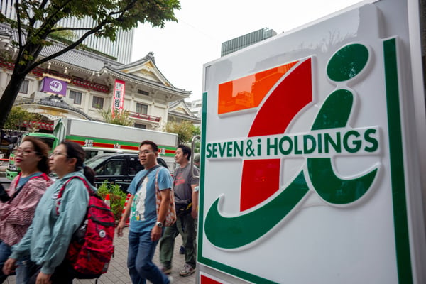 7-Eleven's parent company is raising its profit forecast after gas earnings surge at its North American unit