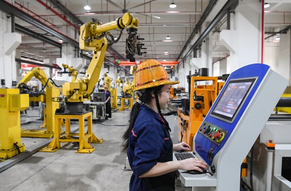 China's factory activity returns to growth in June on AI export demand